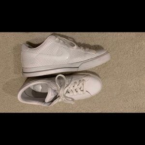 Nike women’s white leather sneakers.